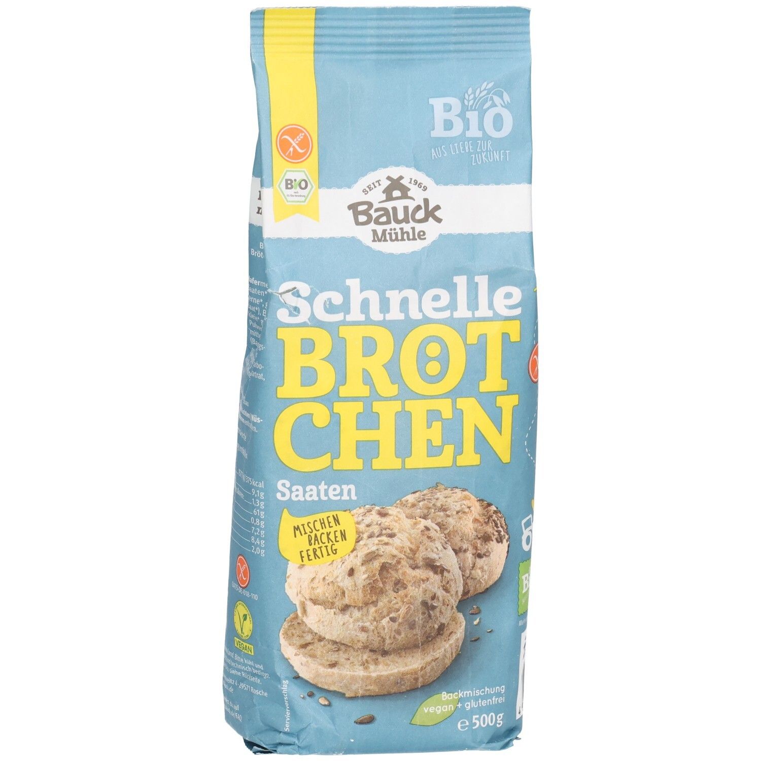 Emballage bleu clair avec l'inscription "Schnelle Brötchen Saaten". Label bio et symbole sans gluten. Illustration de petits pains aux graines.