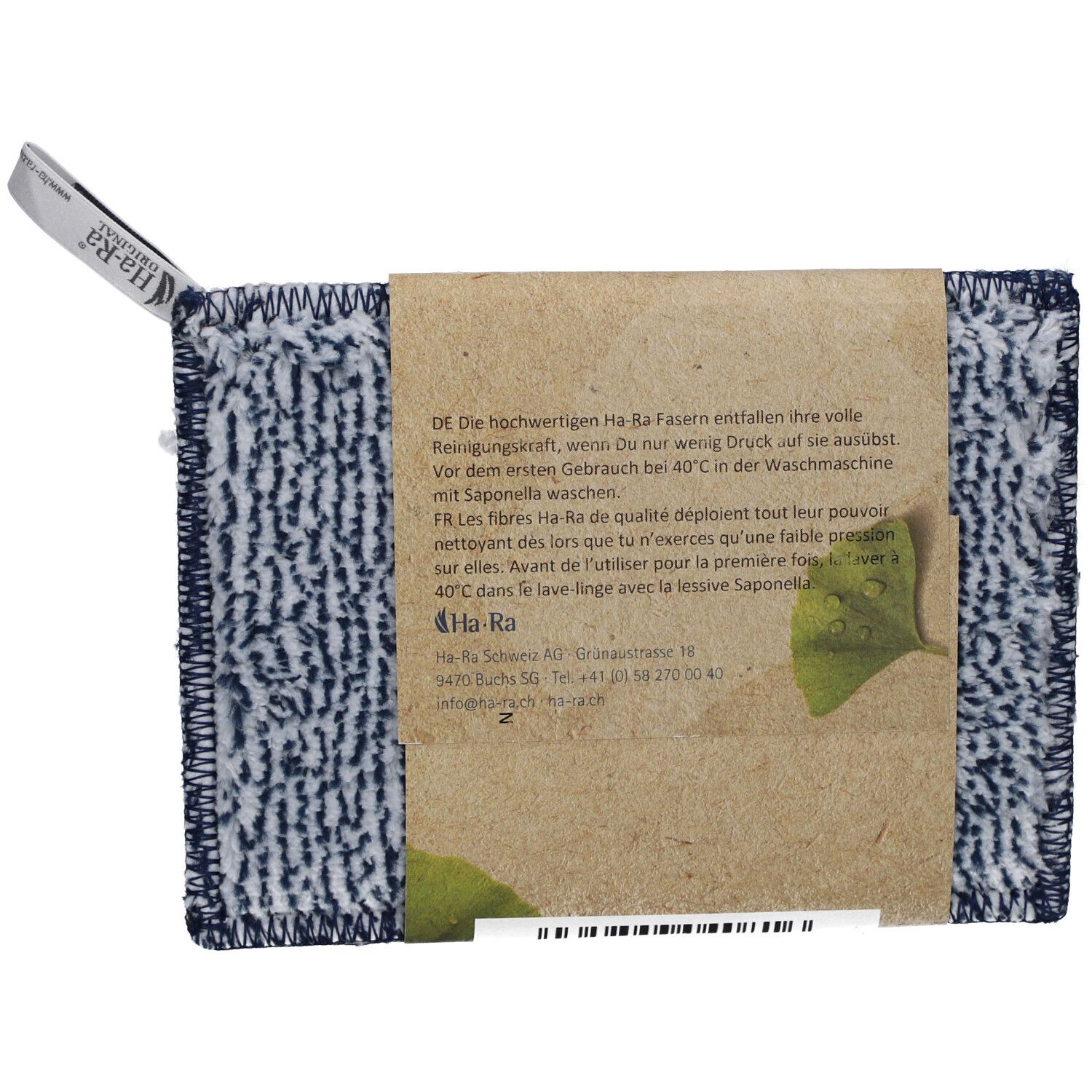 Rückseite des blauen Reinigungstuchs mit Etikett. Text auf Verpackung: Produktinformationen und Ha-Ra Logo.