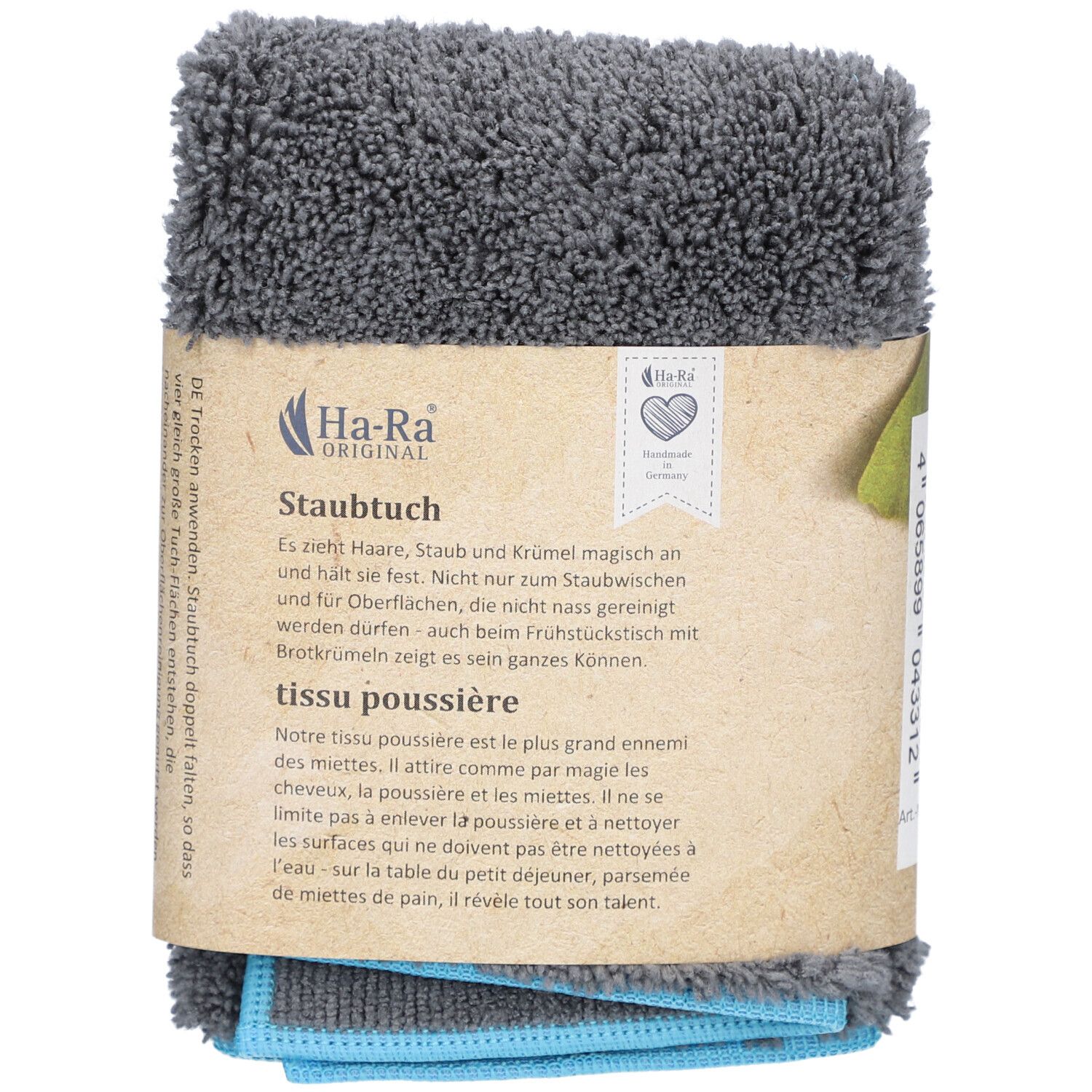 Graues HA-RA Staubtuch, gefaltet und verpackt. Braune Pappbanderole mit Logo und Text. Blaue und graue Tücher sichtbar.