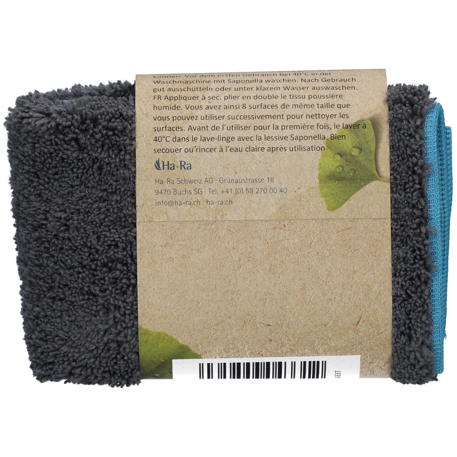 Rückseite des gefalteten HA-RA Staubtuchs. Braune Pappbanderole mit Text und Logo. Blaue und graue Tücher sichtbar.