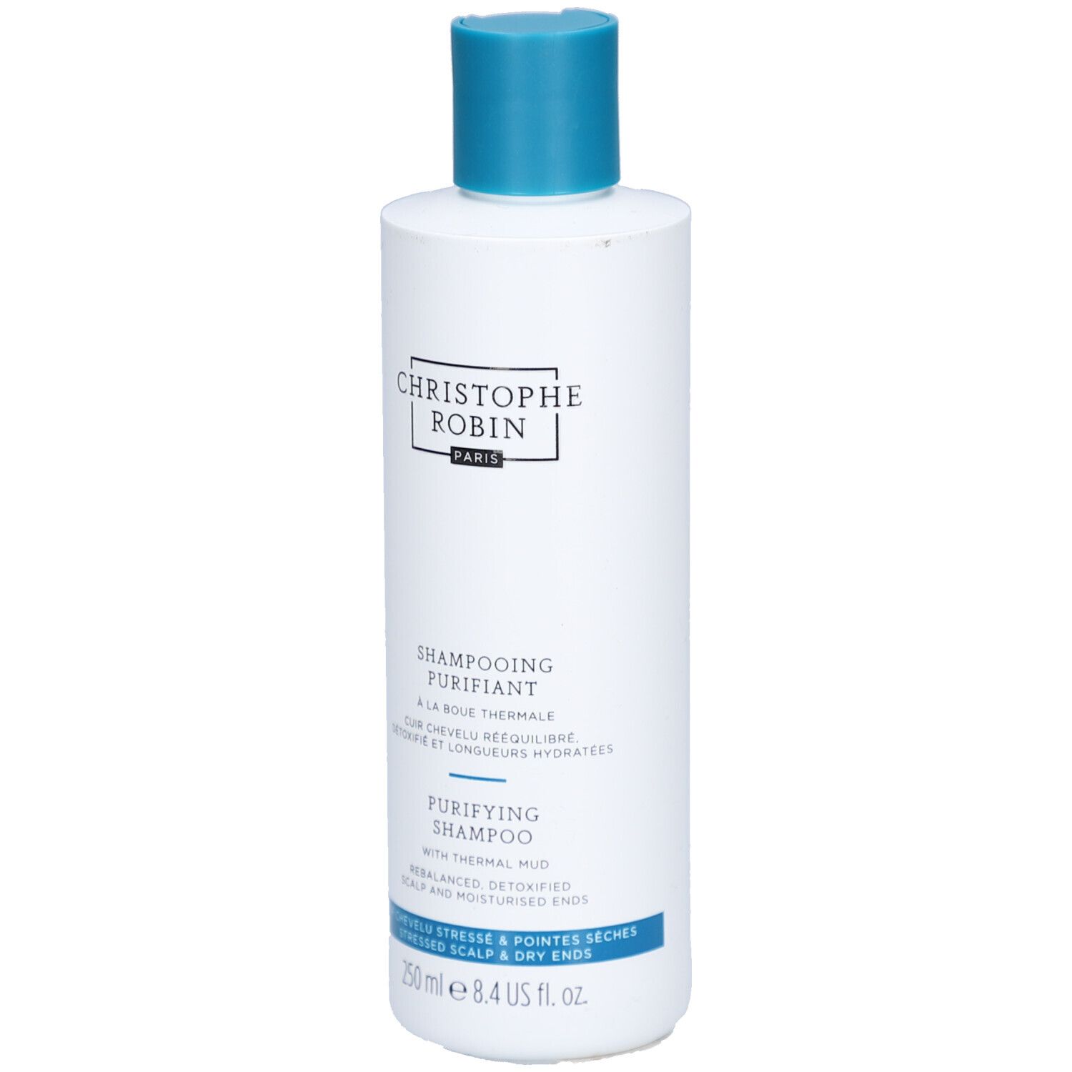 Weiße Flasche mit blauem Deckel. Aufschrift: CHRISTOPHE ROBIN, SHAMPOOING PURIFIANT, PURIFYING SHAMPOO. 250 ml.