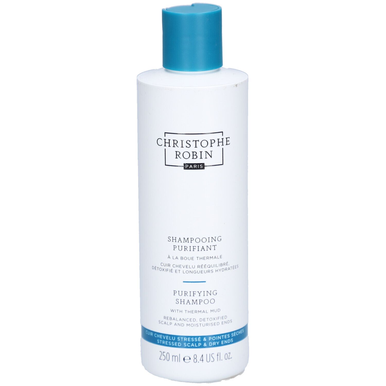 Weiße Flasche mit blauem Deckel. Aufschrift: CHRISTOPHE ROBIN, SHAMPOOING PURIFIANT, PURIFYING SHAMPOO. 250 ml.