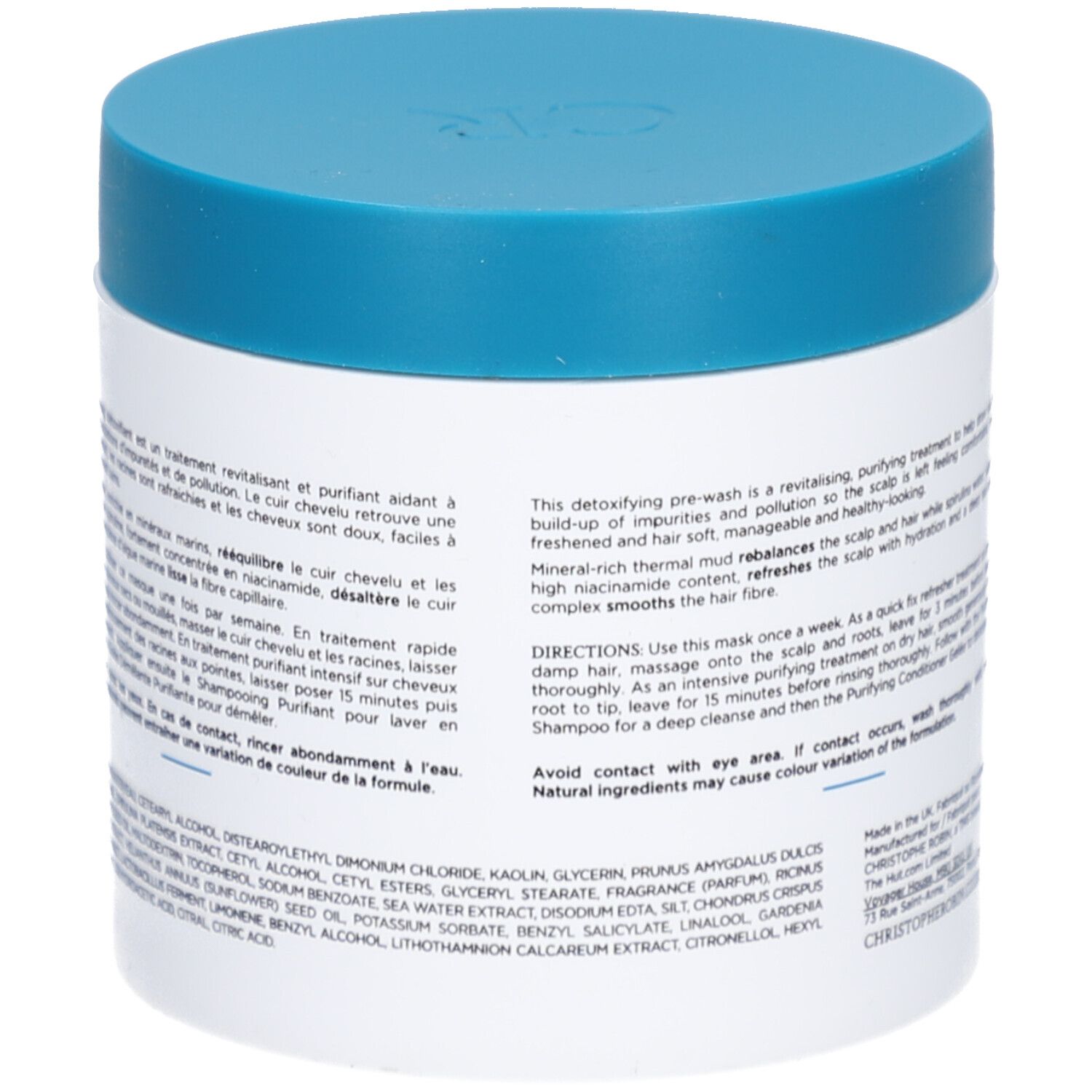 Rückseite des weißen Tiegels mit blauem Deckel. Text über Inhaltsstoffe und Anwendung.