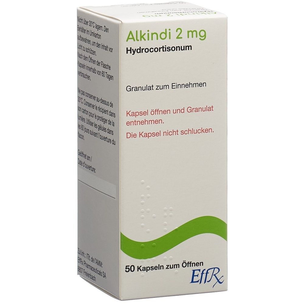 Kartonverpackung mit Produktinformationen. Weiß, mit grünen und roten Akzenten. Text: ALKINDI Gran, 2 mg Kapseln.