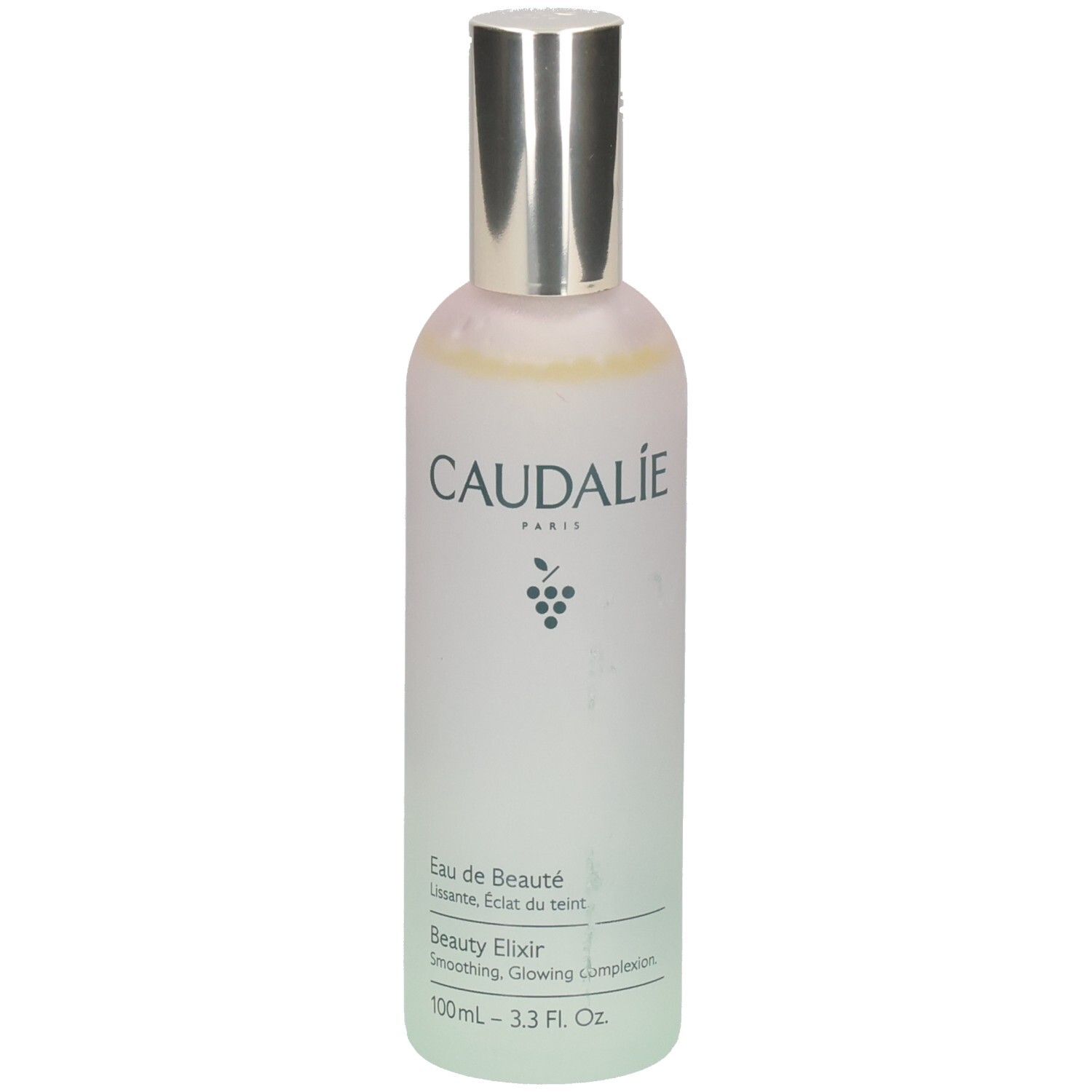 Flacon avec bouchon argenté. Inscription CAUDALIE PARIS, symbole de raisin en dessous. Texte: Eau de Beauté, Beauty Elixir, 100ml.