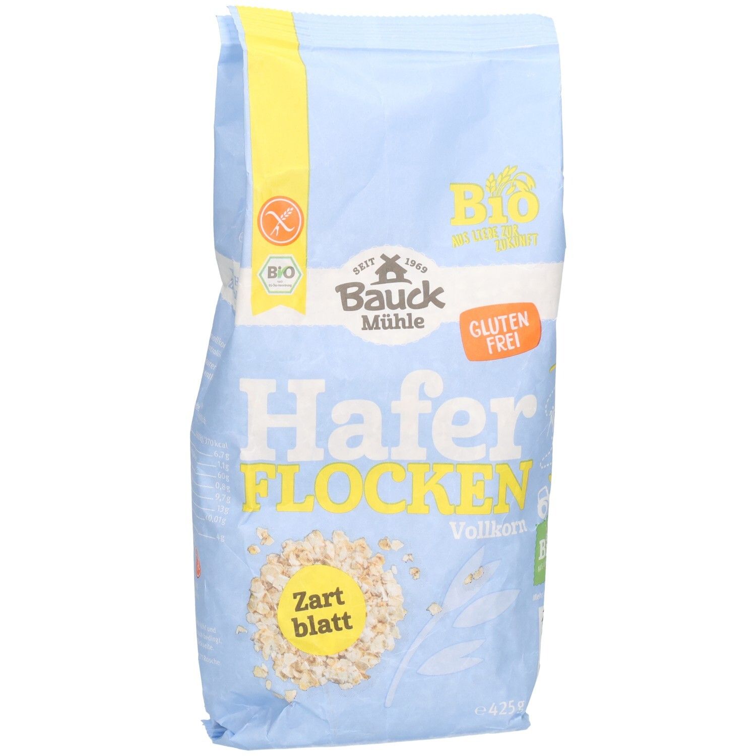 Sachet bleu clair de flocons d'avoine. Inscription : Bauck Mühle, flocons d'avoine complets tendres sans gluten. Label bio et logo sans gluten.