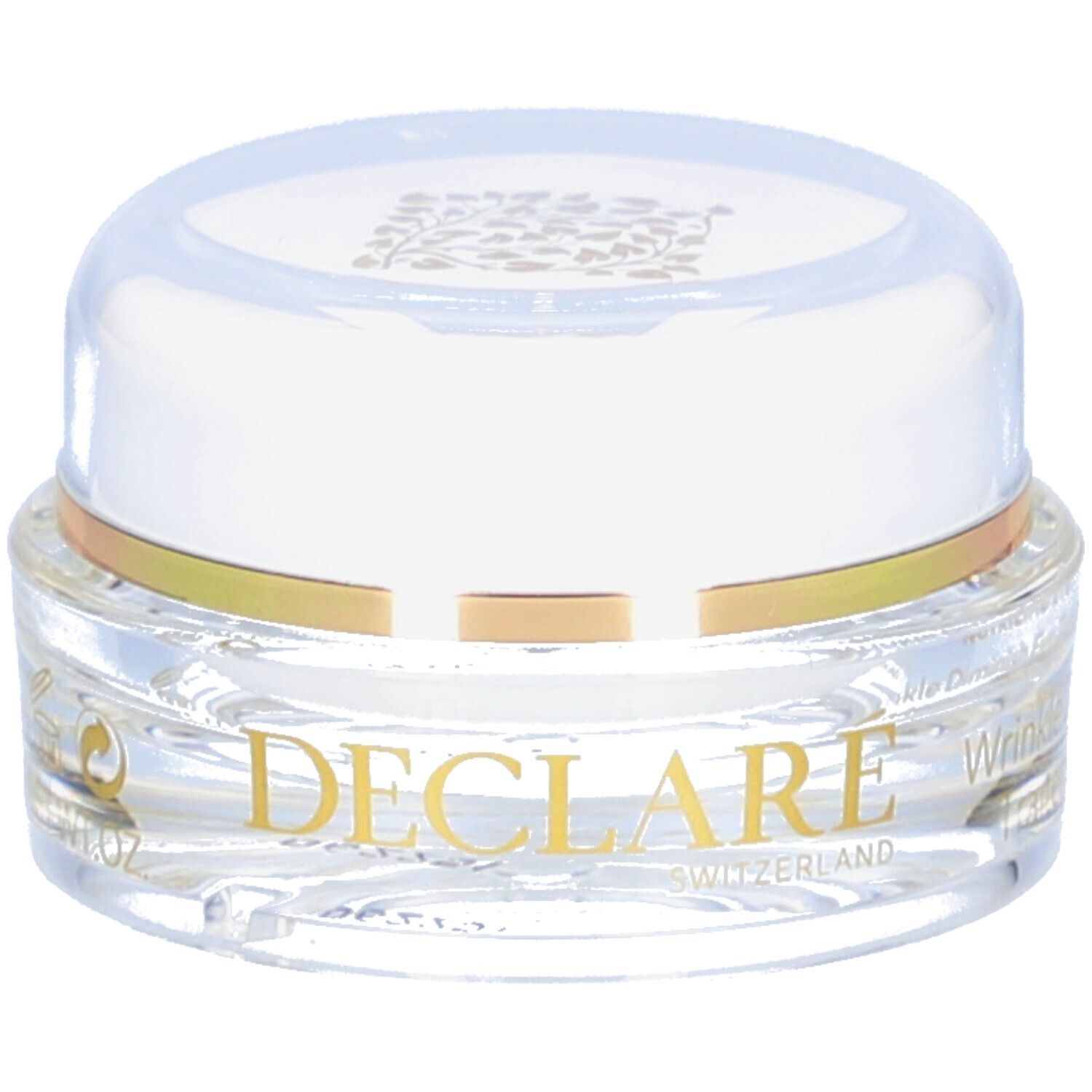 Pot transparent avec couvercle blanc et anneau doré. Inscription DECLARE SWITZERLAND. Produit pour le contour des yeux.