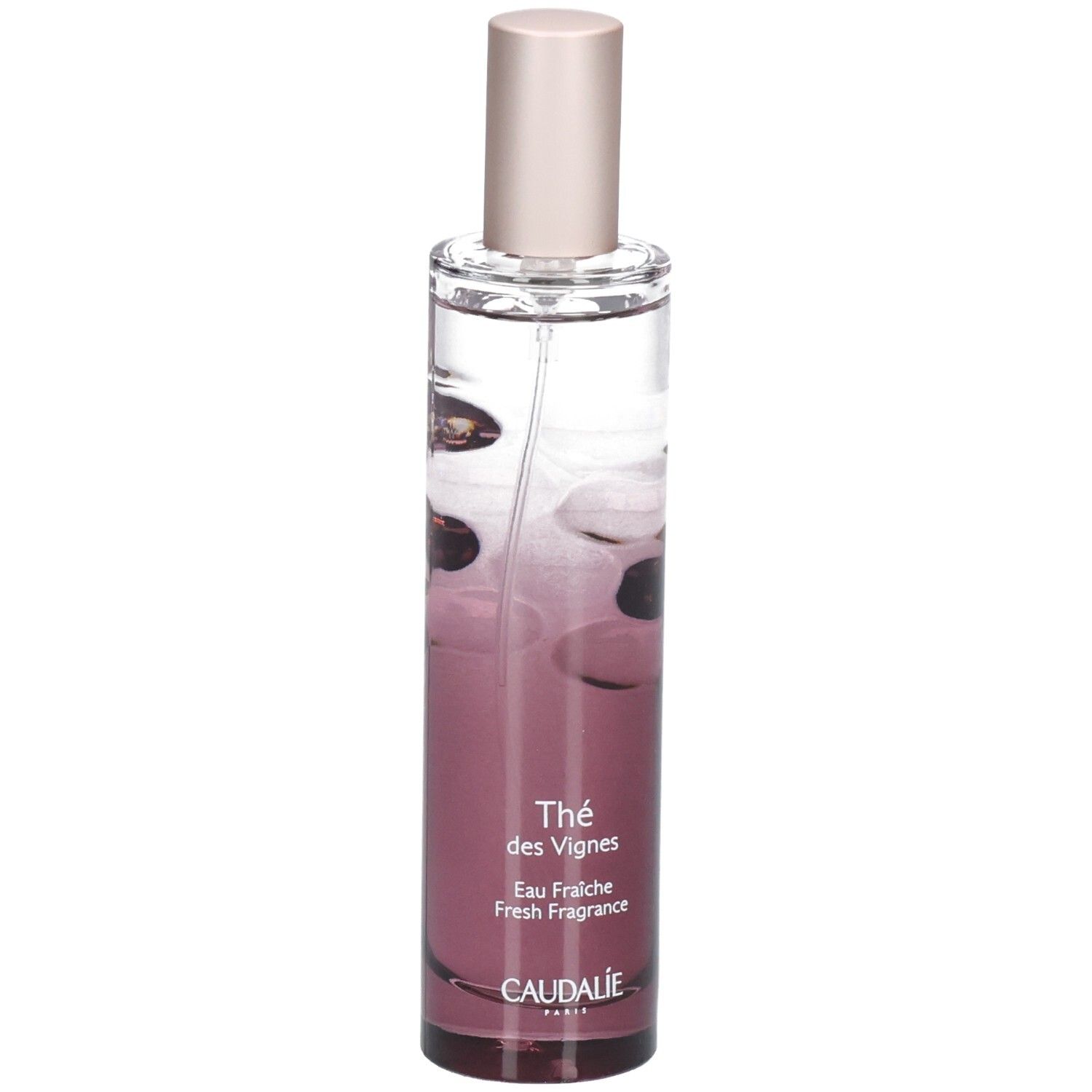 Flacon cylindrique dégradé rose. Liquide transparent. Bouchon rose. Inscription: Thé des Vignes, CAUDALIE.