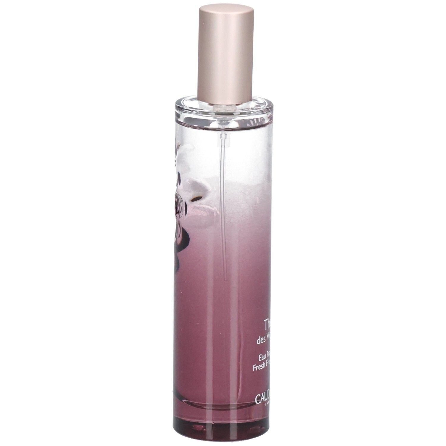 Flacon cylindrique dégradé rose. Liquide transparent. Bouchon rose. Inscription: Thé des Vignes, CAUDALIE.