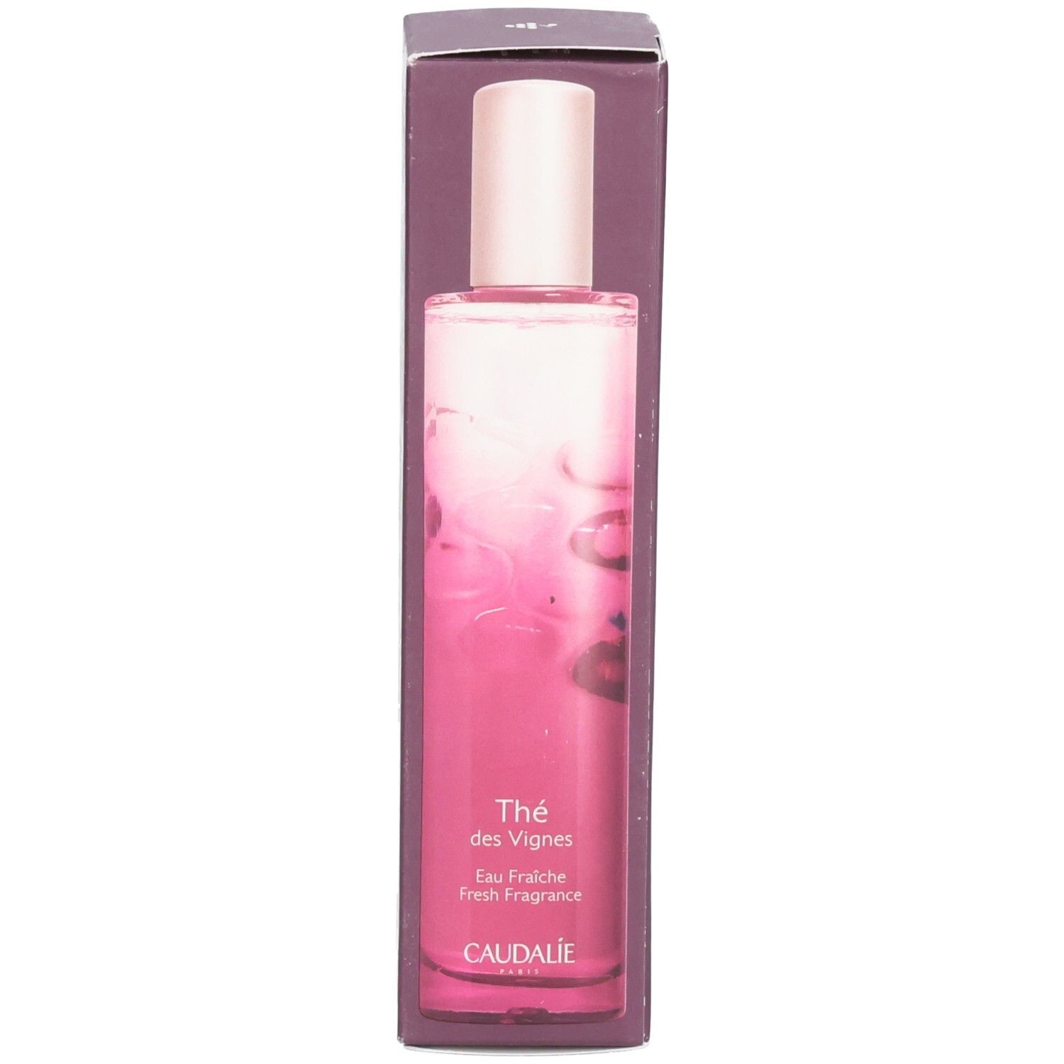 Emballage et flacon. Dégradé rose. Inscription: Thé des Vignes, CAUDALIE. Bouchon rose.