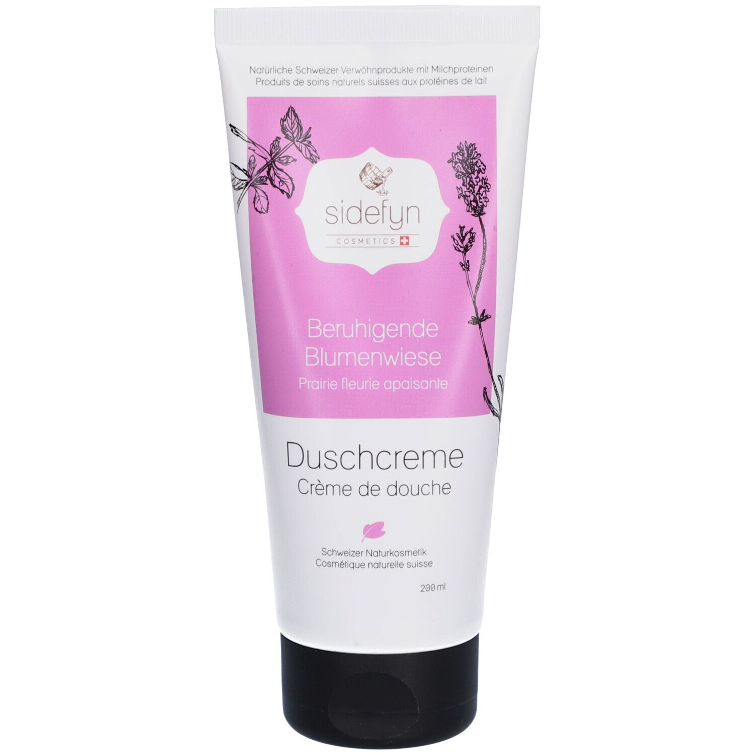 Tube de crème de douche Sidefyn. Étiquette rose avec nom du produit et illustrations florales. Bouchon noir.