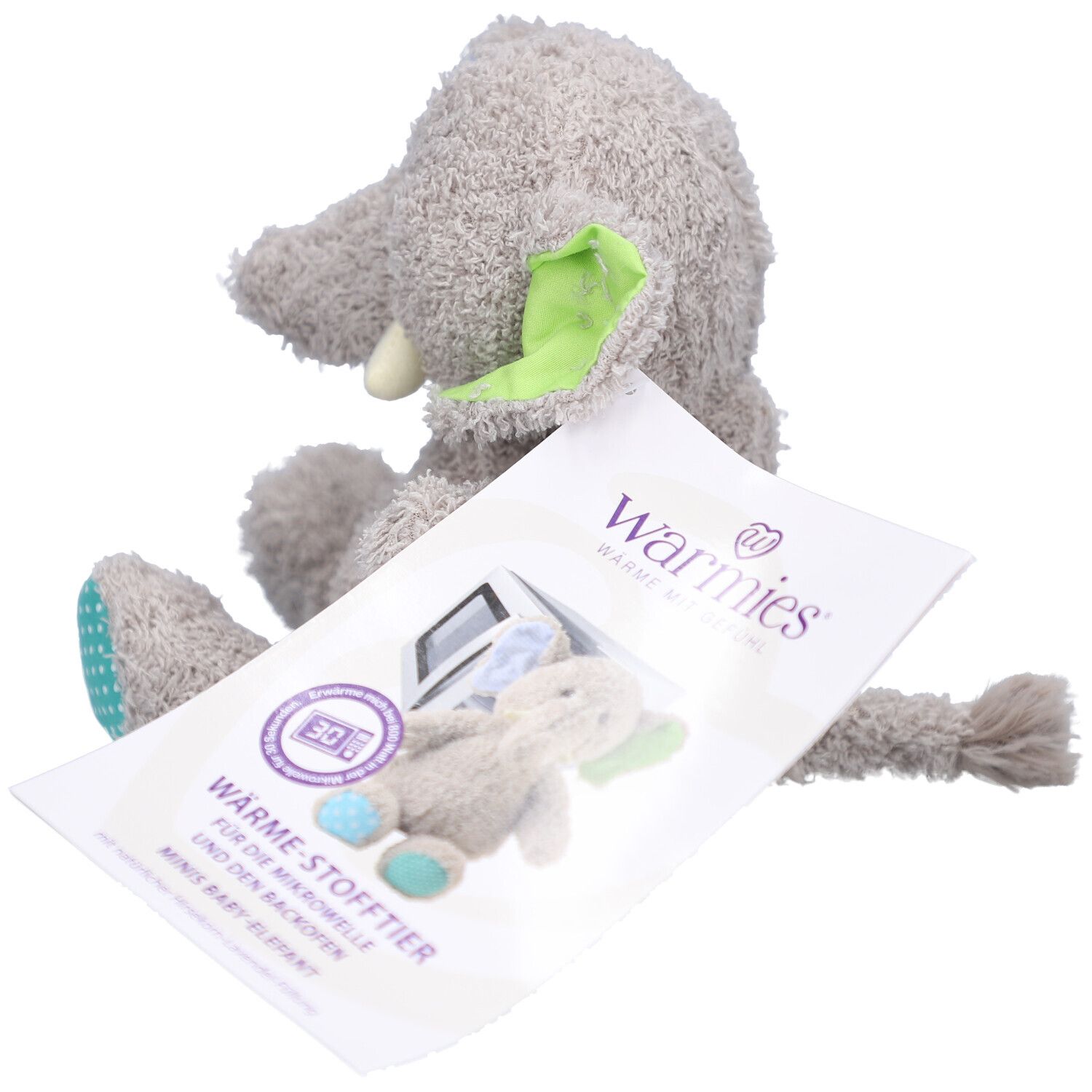 Éléphant en peluche gris avec étiquette. Impression: micro-ondes, bébé éléphant. Logo Warmies®.