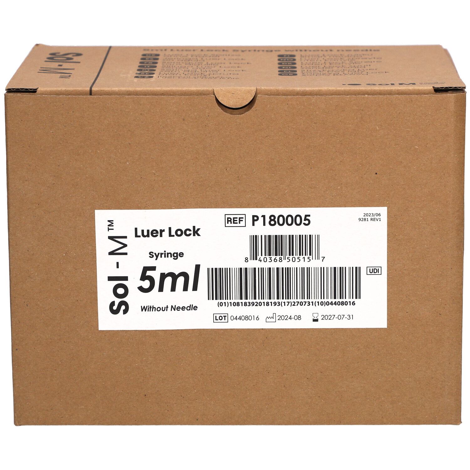 Karton mit Sol-M® Spritzen. Aufkleber mit Produktinformationen: Luer Lock, 5 ml, ohne Nadel.