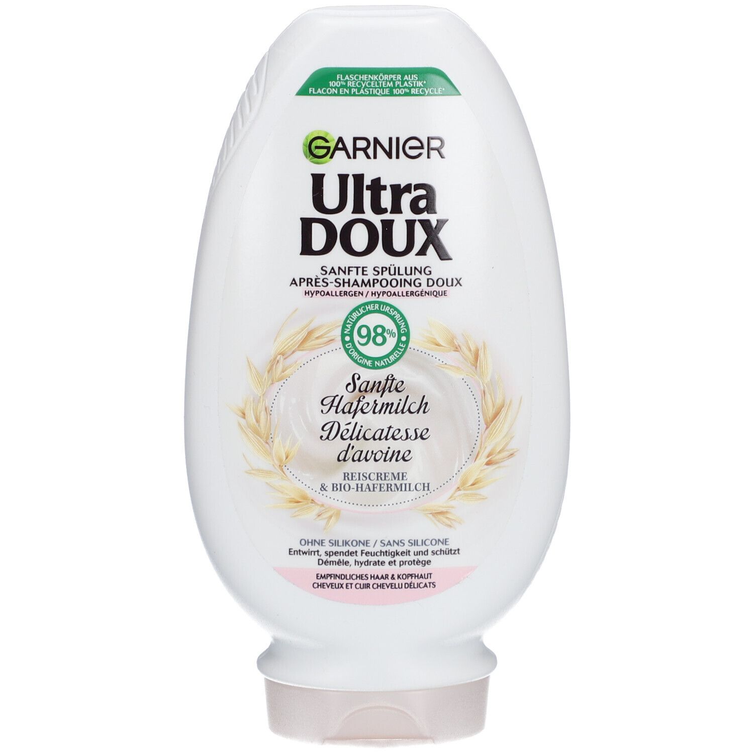Weiße Flasche mit Garnier Ultra Doux Sanfte Spülung. Etikett mit Produktnamen, Hafermilch-Illustration und 98% natürlichen Inhaltsstoffen.