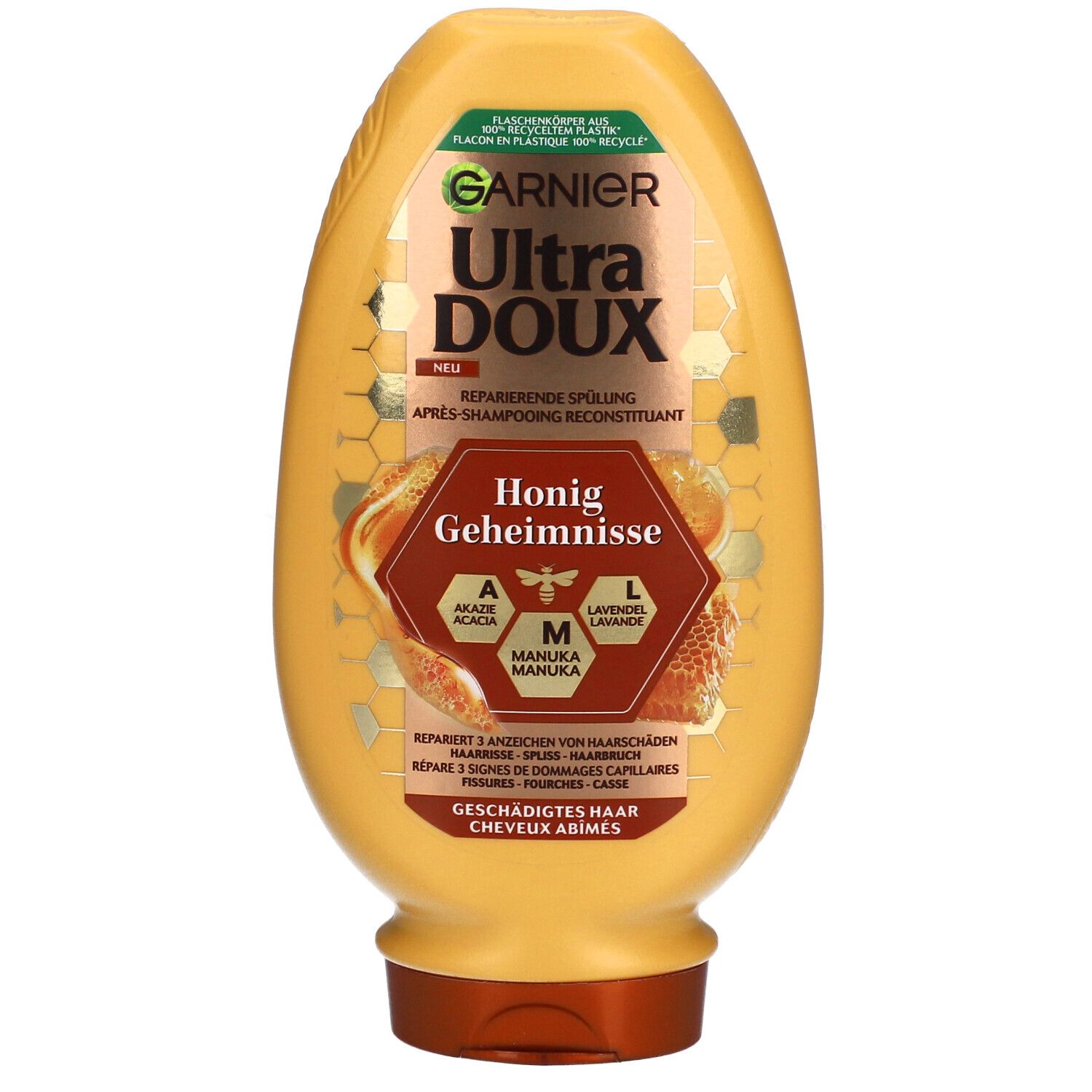 Gelbe Flasche mit Produktetikett. Text: GARNIER Ultra DOUX, Honig Geheimnisse. Enthält Akazien-, Manuka- und Lavendelhonig.