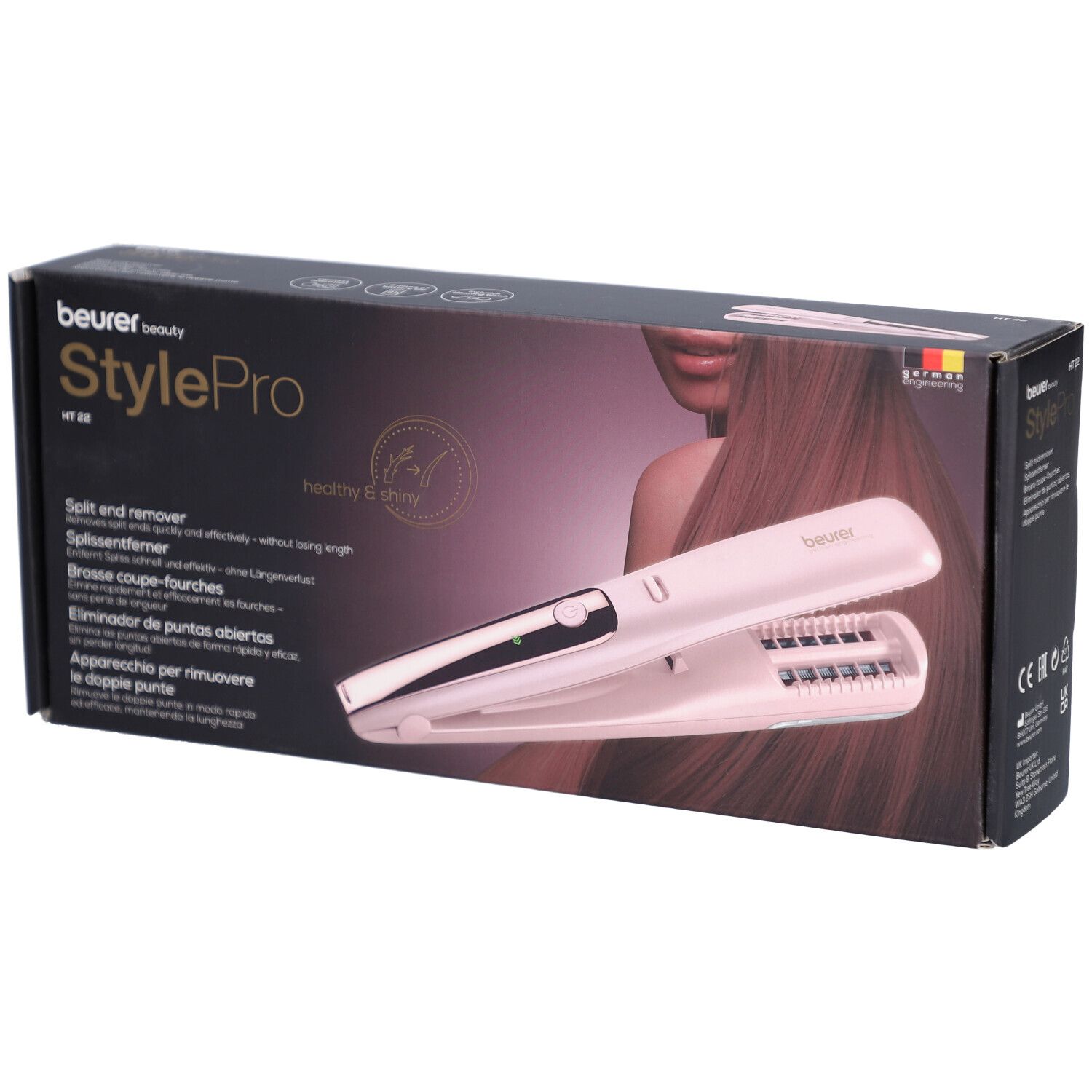 Boîte avec image du produit. Beurer StylePro HT 22. Éliminateur de pointes fourchues. Appareil rose.