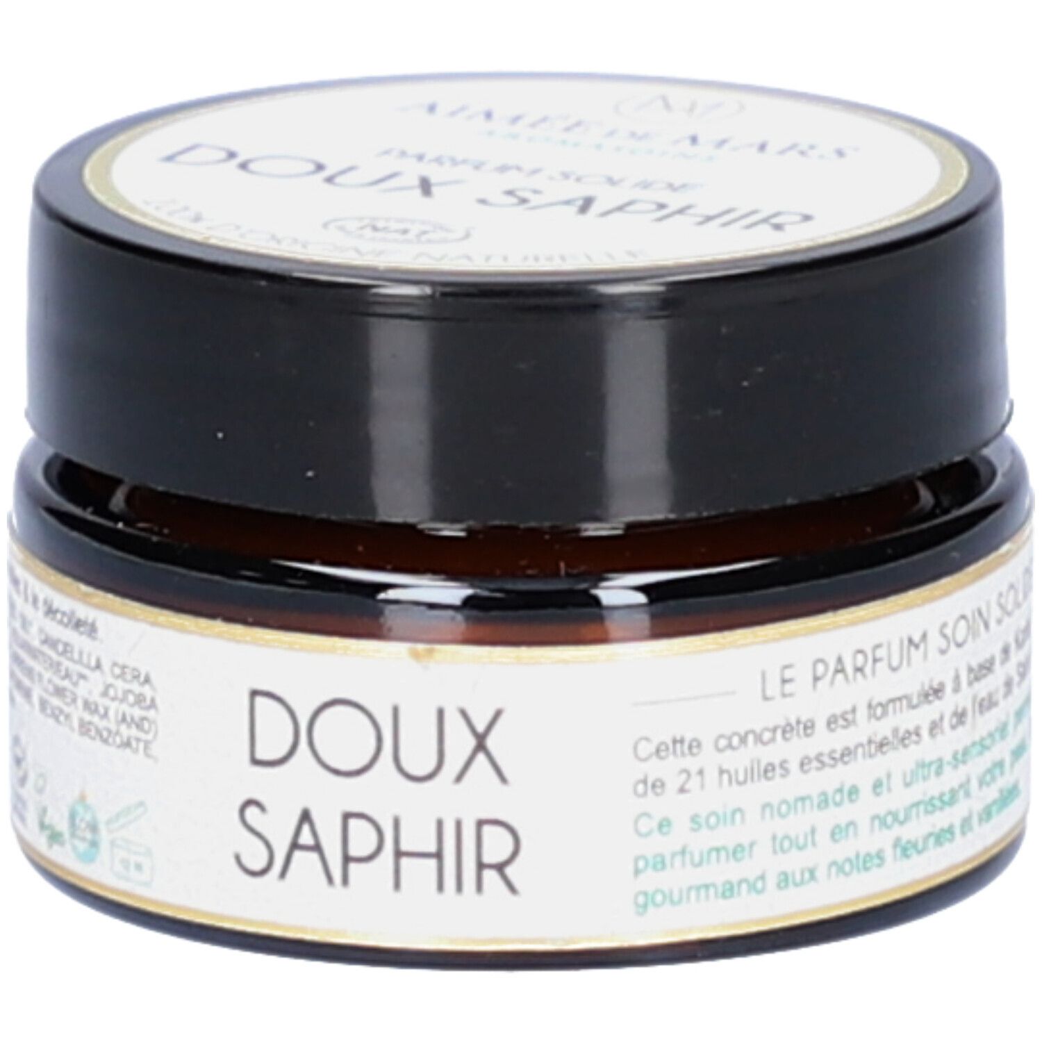 Petit pot rond avec couvercle noir. Inscription: Doux Saphir. Description du produit. Label Vegan.