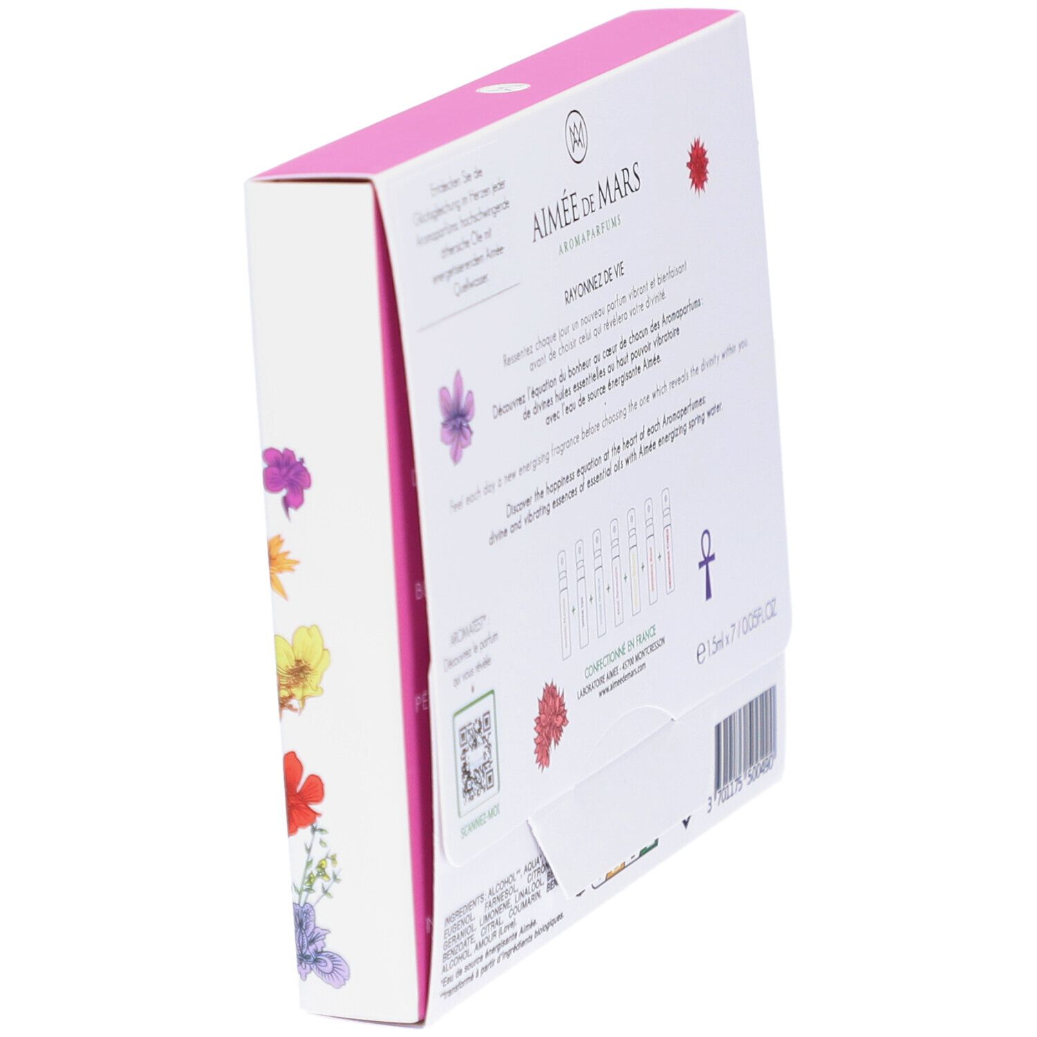 Vue en biais du dos d'une boîte blanche avec texte et illustrations florales. Texte : Aimée de Mars, Rayonnez de Vie.