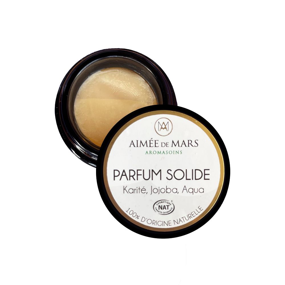 Kleines, rundes Tiegel mit schwarzem Deckel. Auf dem Deckel steht "PARFUM SOLIDE" und Inhaltsstoffe.