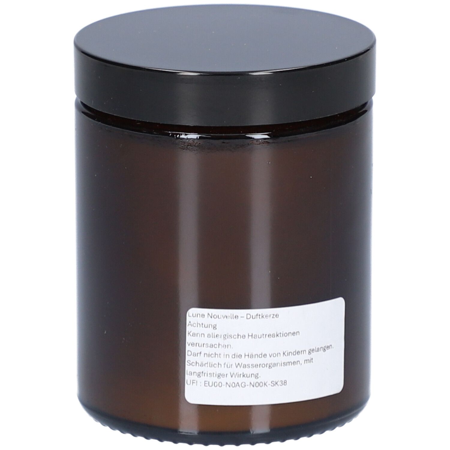 Pot en verre brun avec couvercle noir. Autocollant avec texte. Vue arrière.
