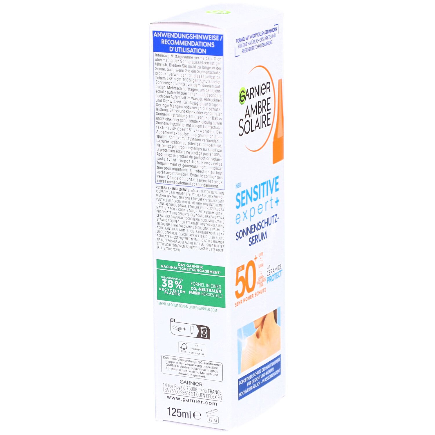 Rückseite der Garnier Ambre Solaire Sonnen-Serum Verpackung. Enthält Produktinformationen, Anweisungen und Zertifizierungen.