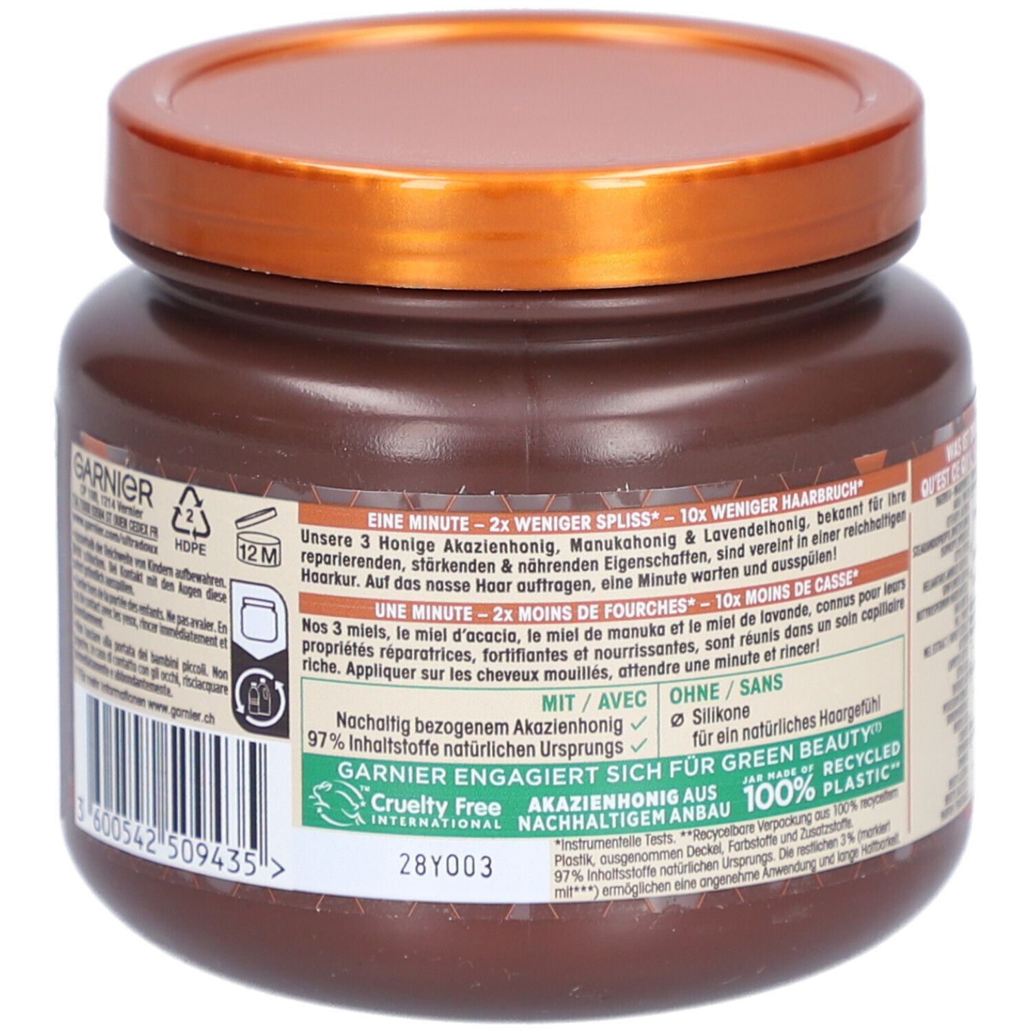 Dos du pot marron. Texte: 2x moins de pointes fourchues, 10x moins de casse. 97% ingrédients naturels. Sans silicones.