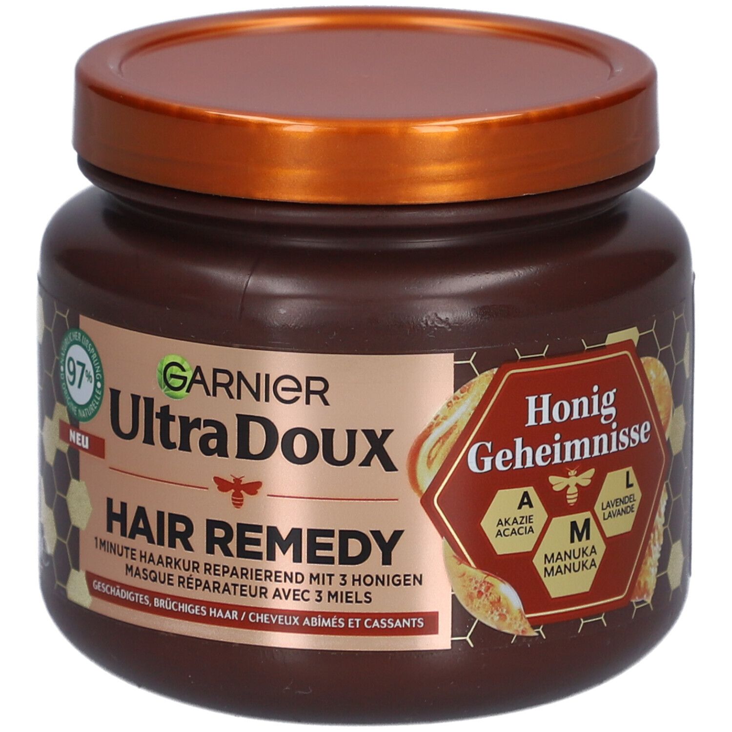 Pot marron avec couvercle. Inscription: GARNIER Ultra Doux Hair Remedy. Secrets de miel. 97% d'origine naturelle.