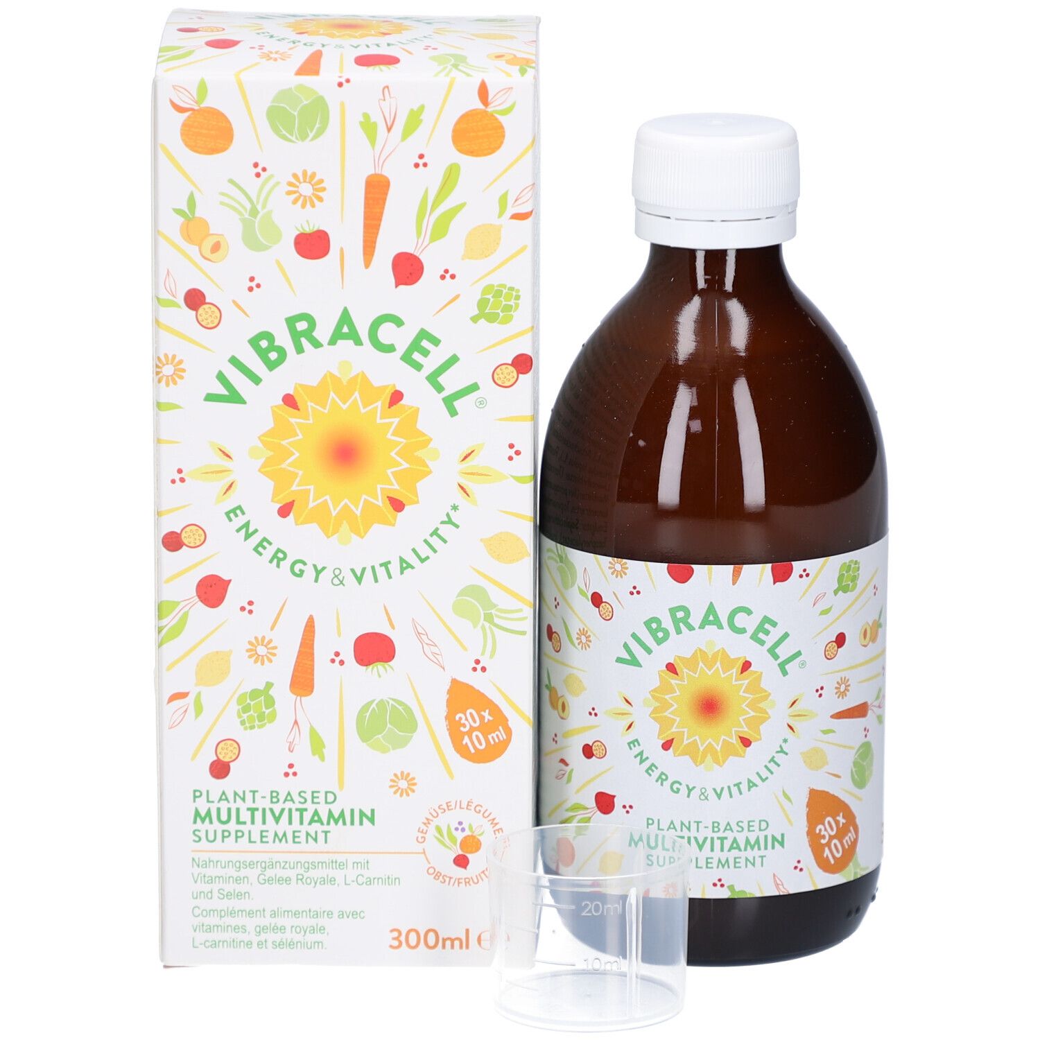 Braune Glasflasche und Karton mit Produktinformationen. Messbecher enthalten. Pflanzliches Multivitamin-Supplement.