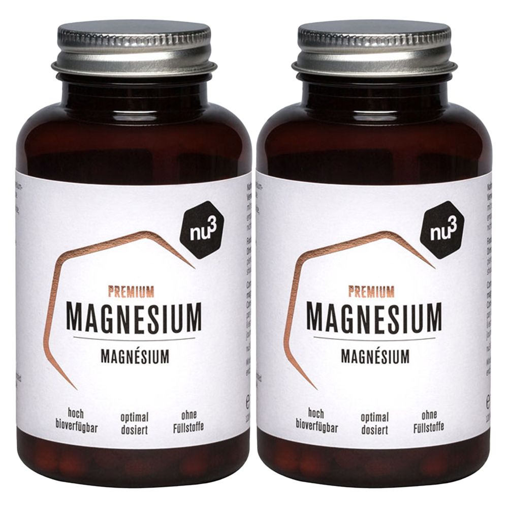 Zwei Flaschen nu3 Premium Magnesium Komplex. Braune Glasflaschen mit silbernen Deckeln und weißen Etiketten. Aufschrift: PREMIUM MAGNESIUM.
