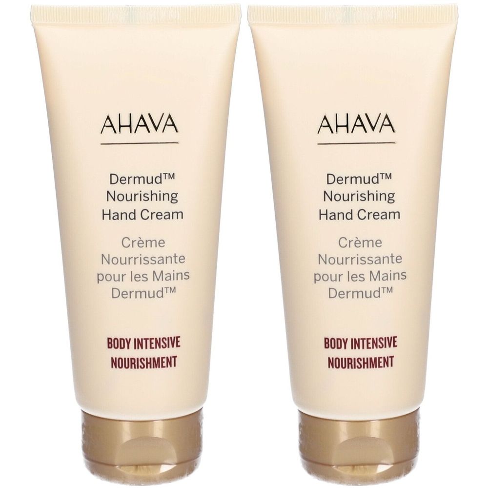 Deux tubes de crème pour les mains AHAVA Dermud. Tubes beiges avec texte marron. Nom du produit et texte visibles.