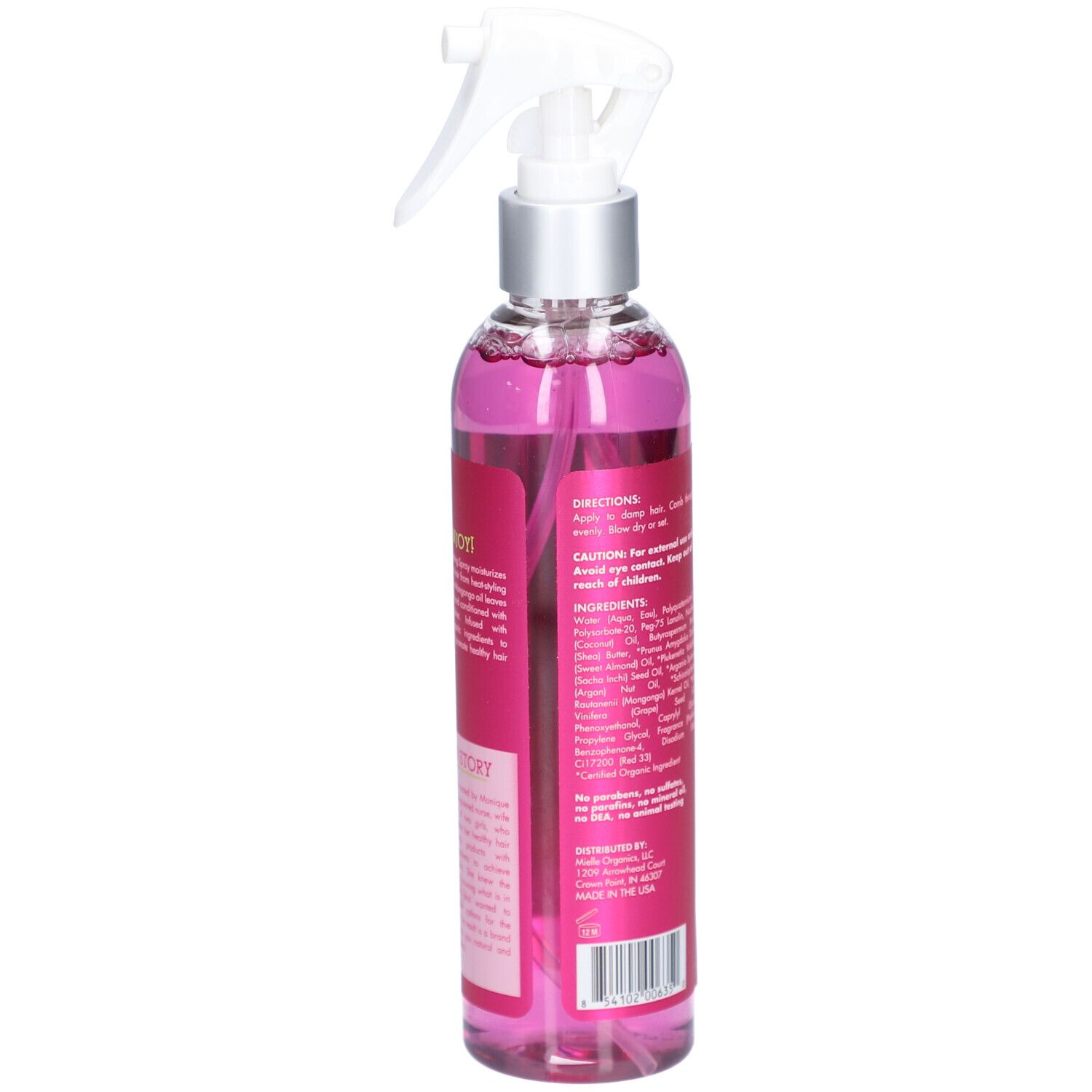 Flacon avec vaporisateur. Liquide rose. Inscription : Mielle, Mongongo Oil Style Setting Spray. Texte au dos.