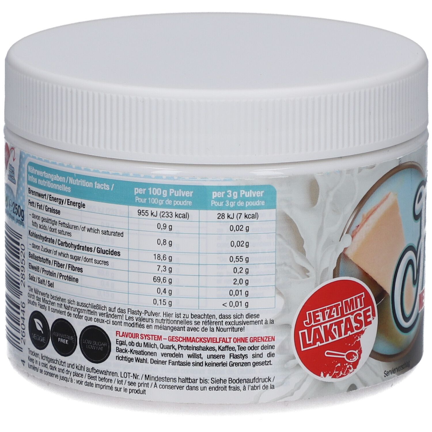 Dos du récipient blanc. Tableau nutritionnel et texte. Inscription : Maintenant avec du lactose. Labels végétalien et sans gluten.