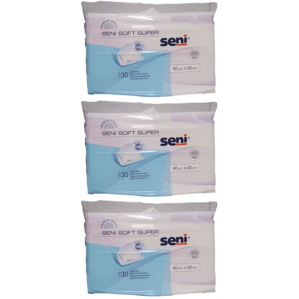 Trois paquets de protections Seni Soft Super. Chaque paquet affiche la marque Seni, la taille 40x60 cm et le nombre 30.