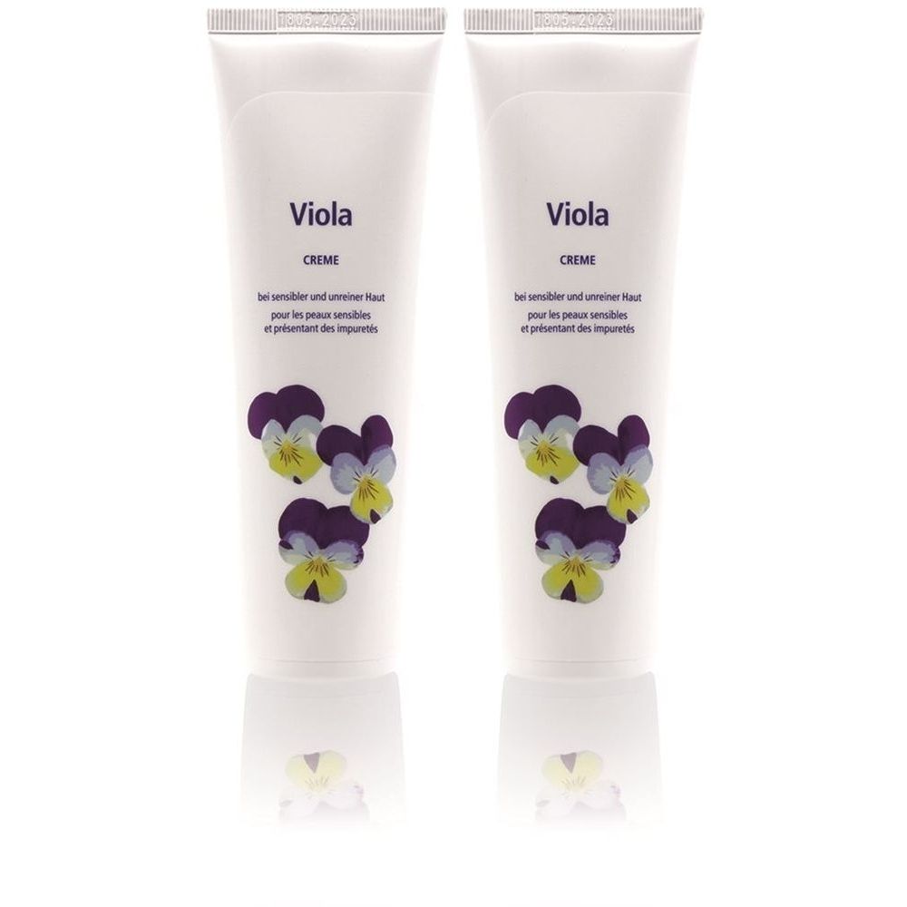 Zwei Tuben Creme mit dem Aufdruck "Viola". Auf den Tuben sind Veilchen abgebildet. Text in Deutsch und Französisch.