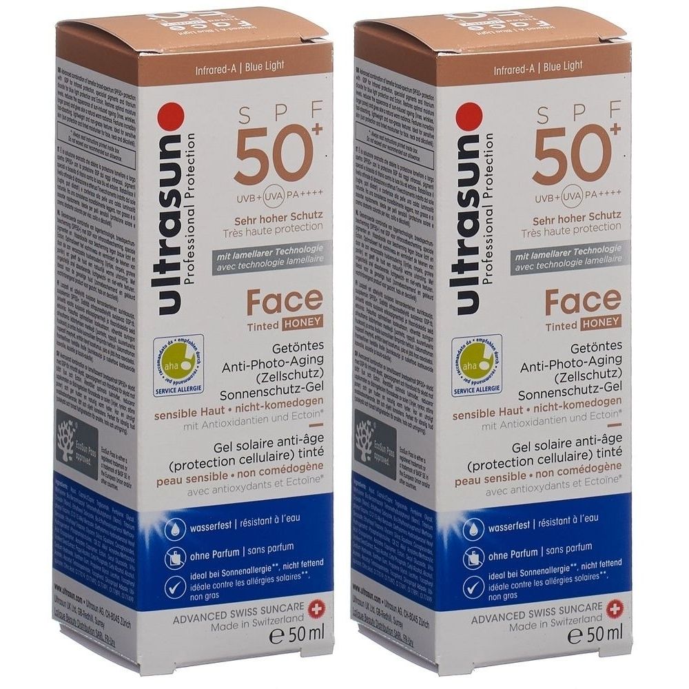Zwei rechteckige Kartons mit Sonnencreme. Aufschrift: ultrasun, SPF 50+, Face, getönt, Anti-Photo-Aging. Mit Schweizer Qualitätssiegel.