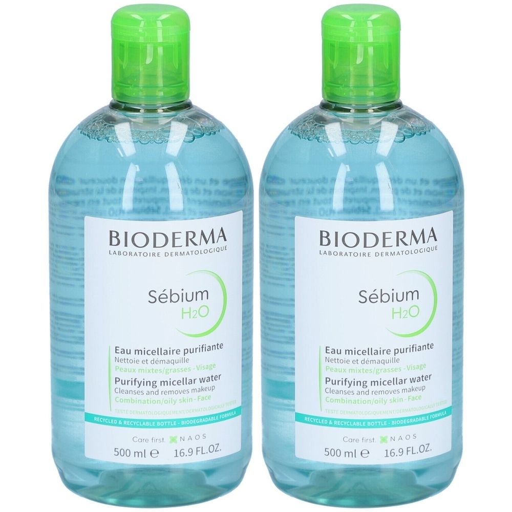 Deux flacons de Bioderma Sébium H2O. Liquide clair dans des bouteilles transparentes avec bouchons verts. Étiquettes avec informations produit.