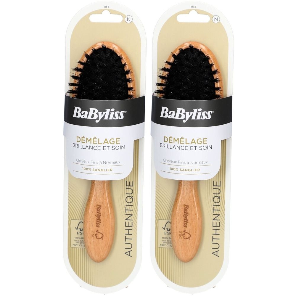 Zwei Haarbürsten in Verpackung. Holzgriff, schwarze Borsten. Marke BaByliss. Aufschrift: Démêlage Brillance et Soin.