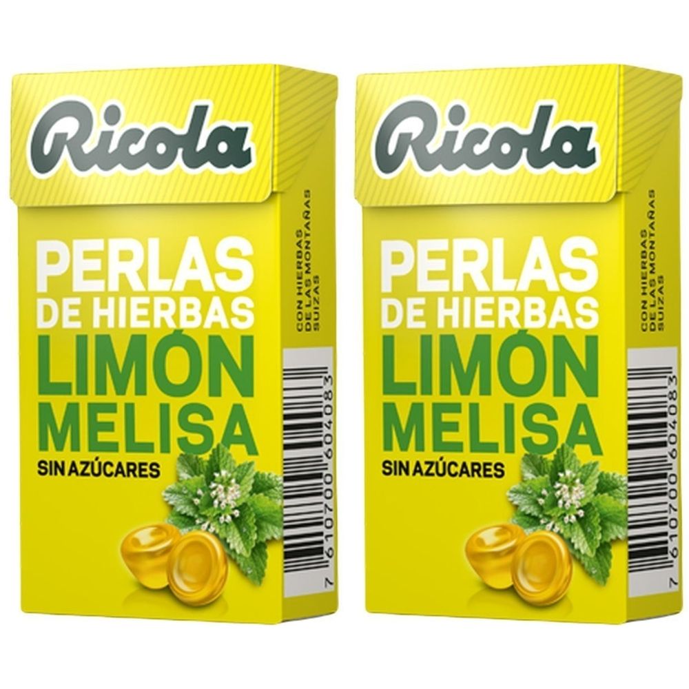 Deux boîtes jaunes "Ricola". Inscription: "PERLAS DE HIERBAS LIMON MELISA SIN AZÚCARES". Illustration d'herbes et de bonbons.