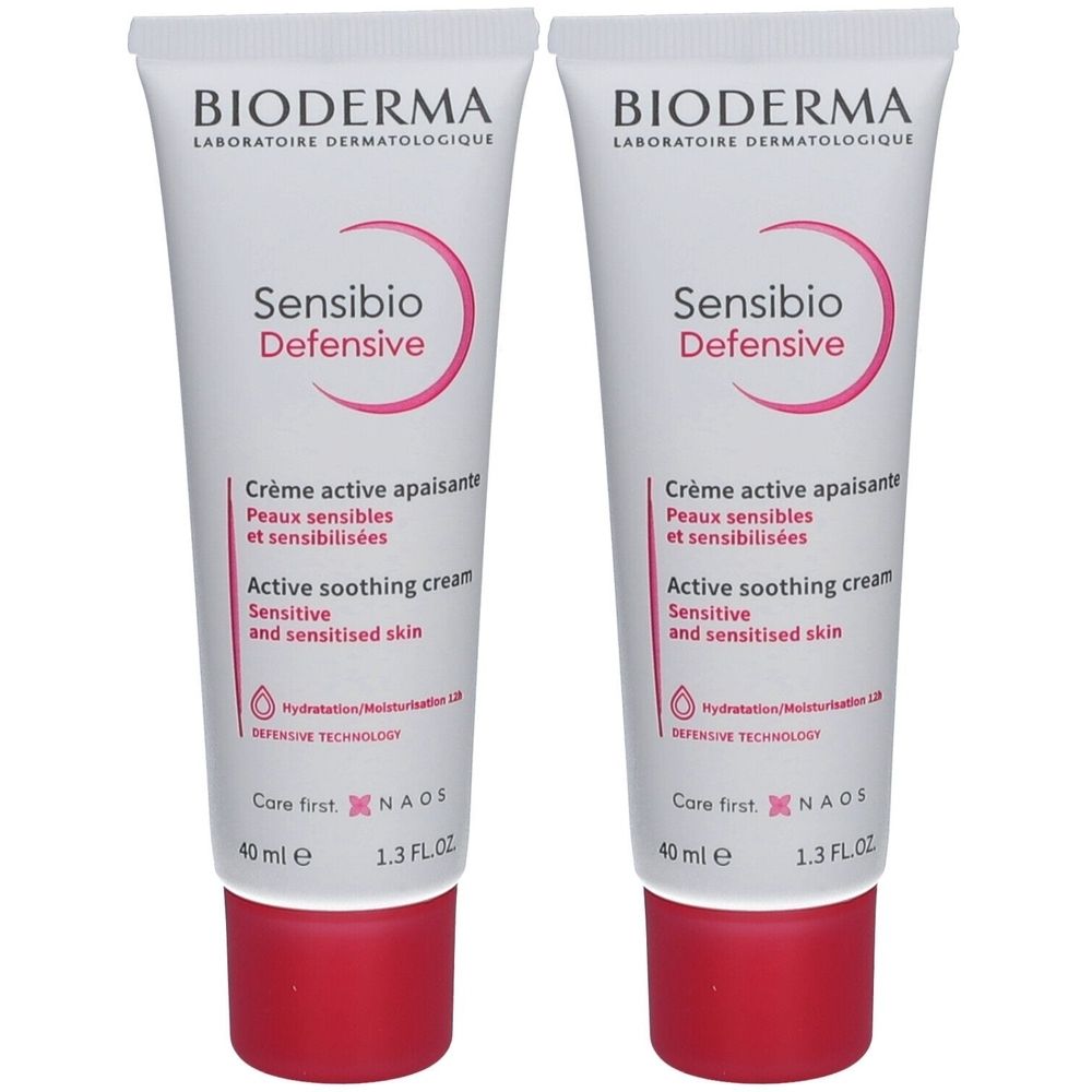 Deux tubes de crème BIODERMA Sensibio Defensive. Tubes blancs avec texte et bouchon rouges. Inscription : Active soothing cream.