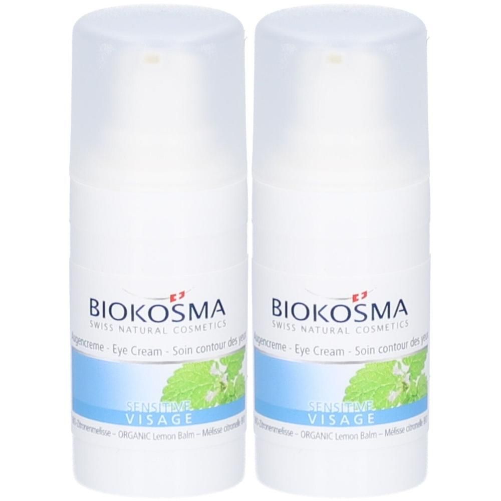 Deux flacons blancs de crème pour les yeux Biokosma. Inscription: Eye Cream, Sensitive Visage. Avec illustration de feuilles.