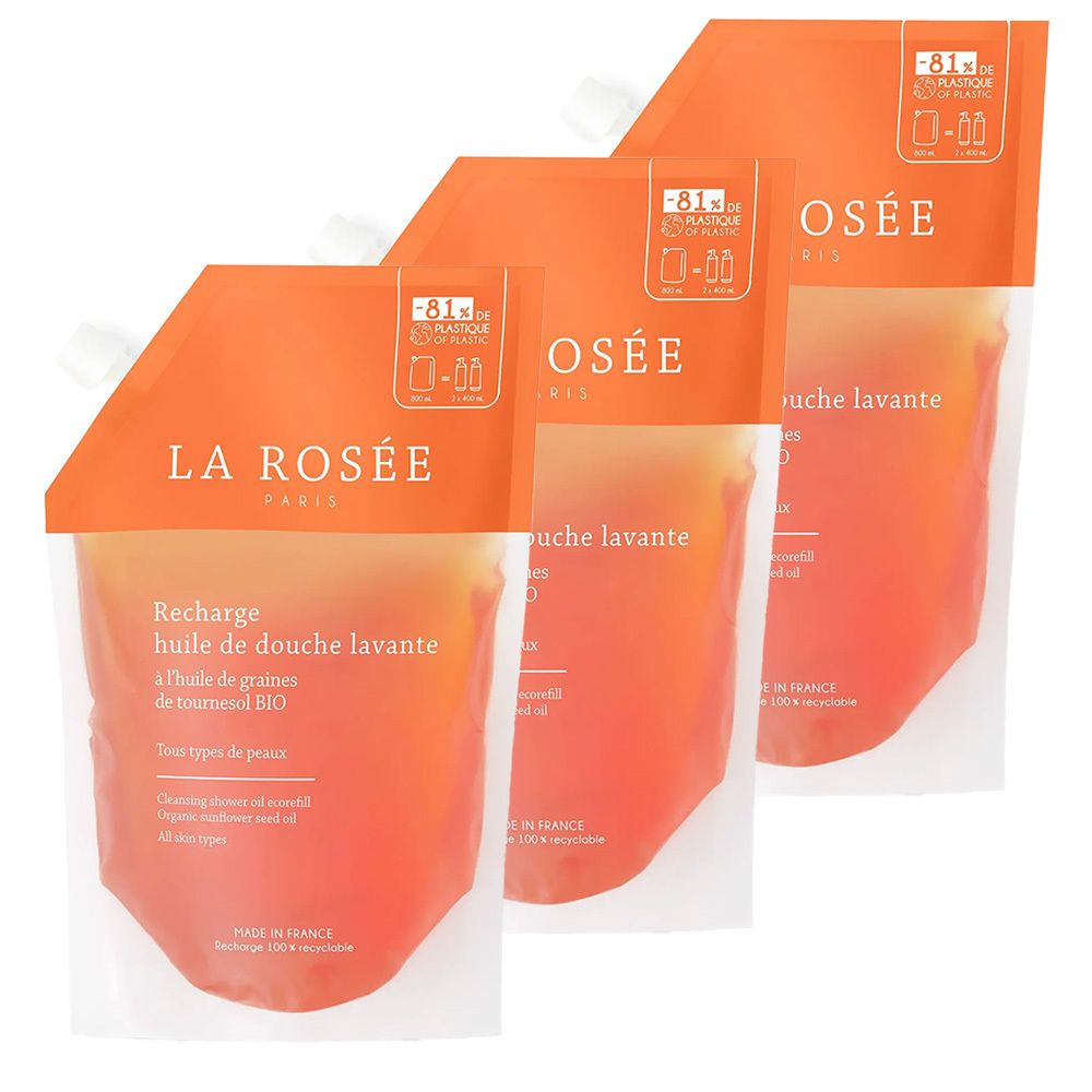Drei Nachfüllbeutel. Orangefarbener oberer Teil mit weißem Beutel. Aufschrift: LA ROSÉE, Recharge huile de douche lavante.