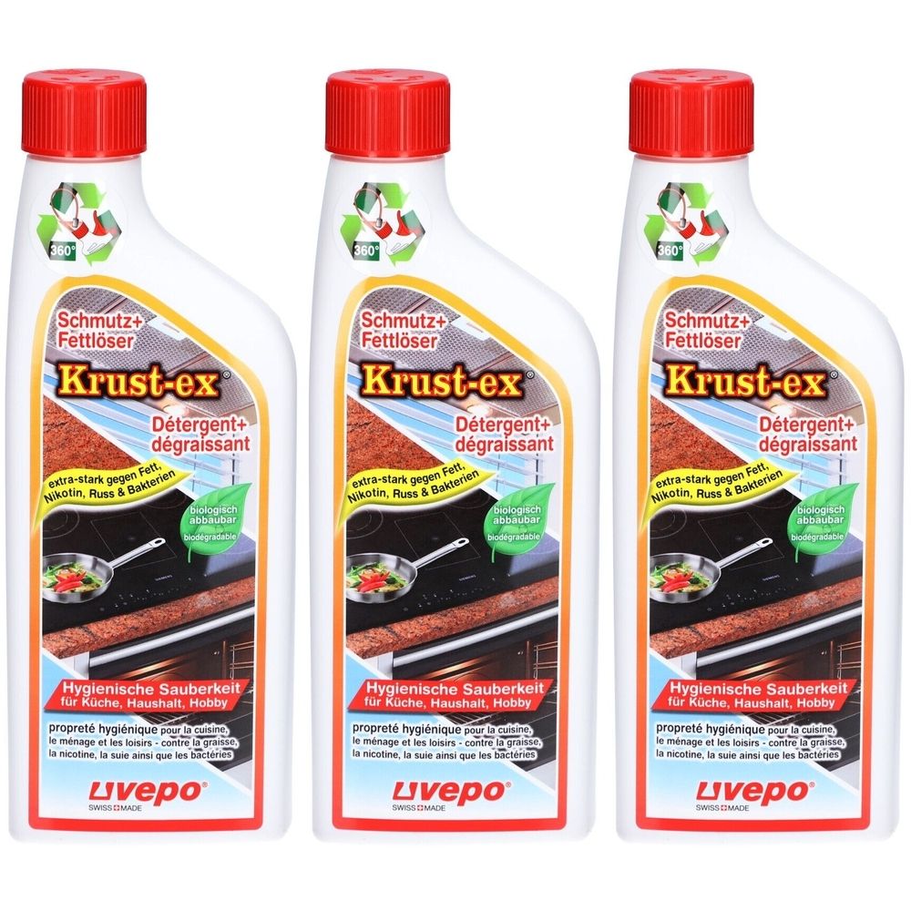 Drei Flaschen mit rotem Deckel. Aufschrift: Krust-ex, Schmutz+Fettlöser. Hygienische Sauberkeit für Küche, Haushalt, Hobby.