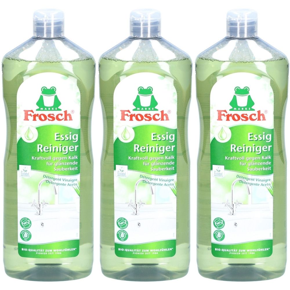 Drei grüne Flaschen mit Frosch Essig Reiniger-Etiketten. Aufschrift: Essig Reiniger, gegen Kalk. Grünes Logo: Frosch.