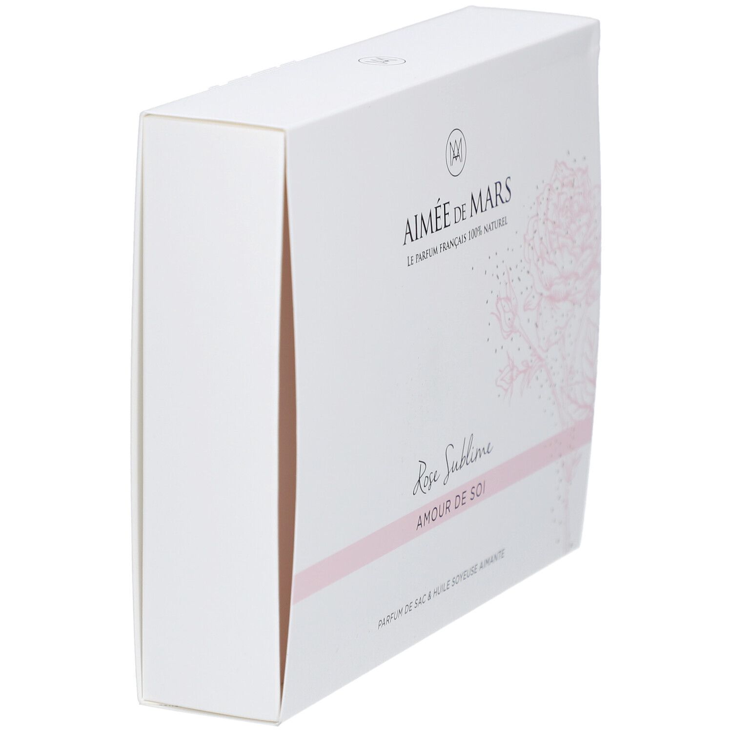 Weiße Geschenkbox, schräg gestellt. Aufschrift: Aimée de Mars, Rose Sublime, Amour de Soi. Rosafarbenes Rosendesign.