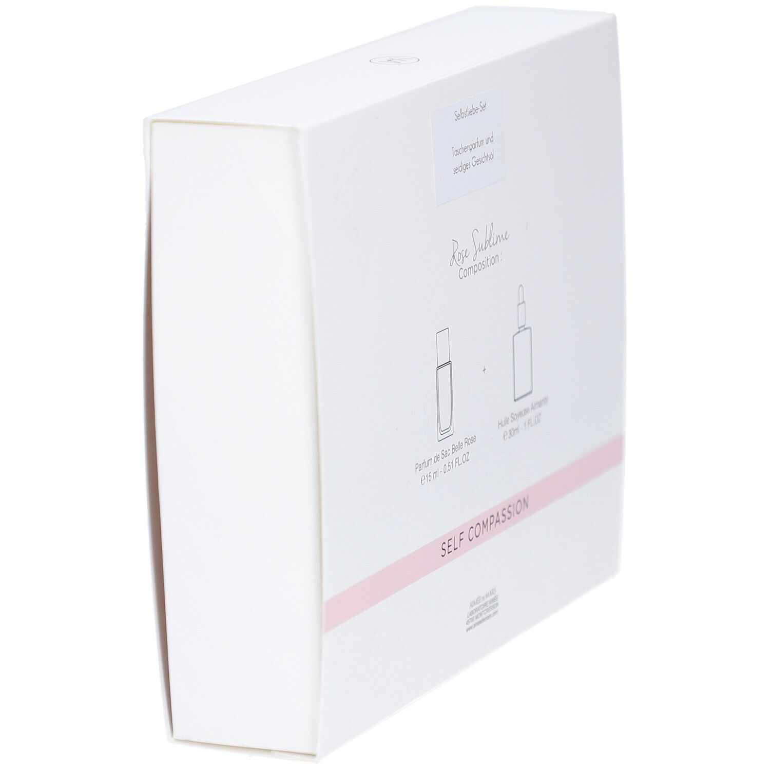 Schräg gestellte Rückseite der weißen Geschenkbox. Aufschrift: Rose Sublime, Self Compassion. Abbildung von zwei Flakons.