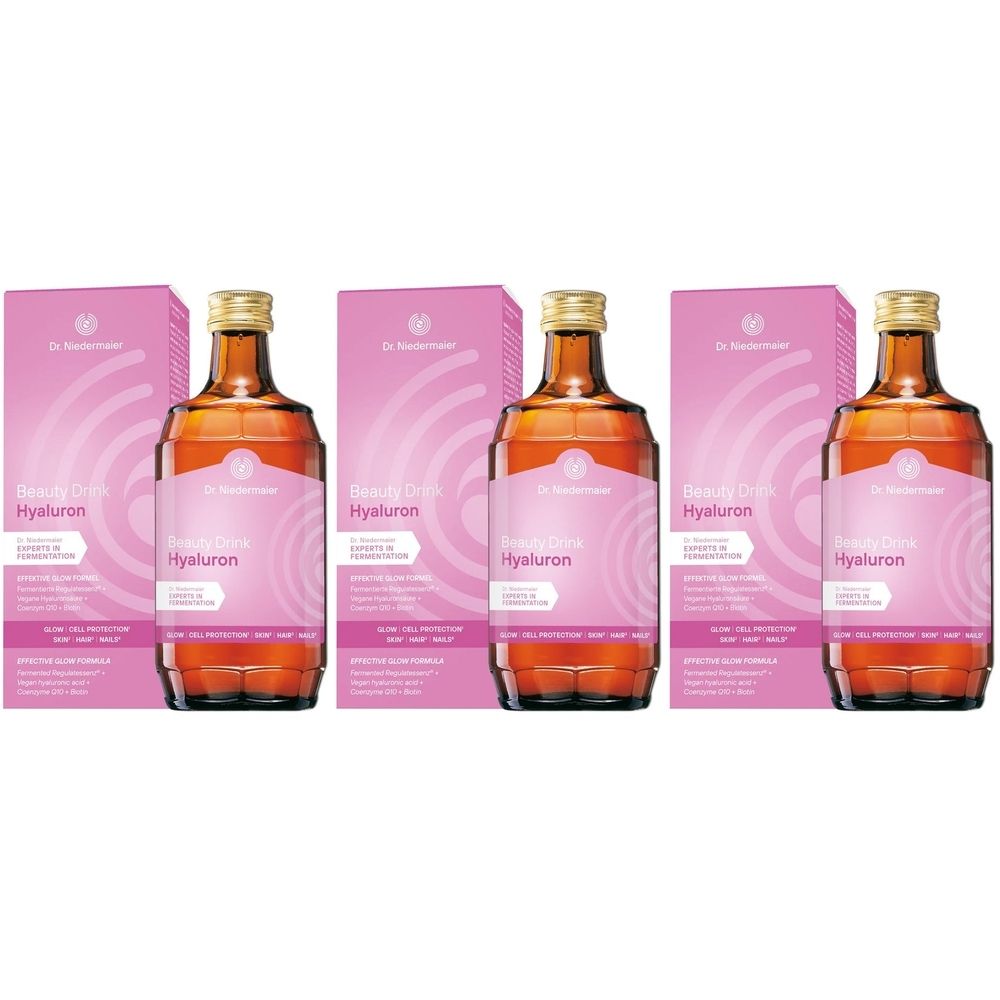 Trois bouteilles avec bouchons dorés et étiquettes roses, accompagnées de boîtes roses avec informations produit.