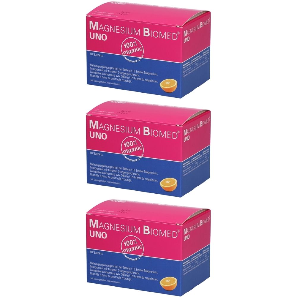 Trois boîtes de Magnésium Biomed UNO. Emballage rose et bleu avec nom du produit et logo "100% organic". Une orange est illustrée.