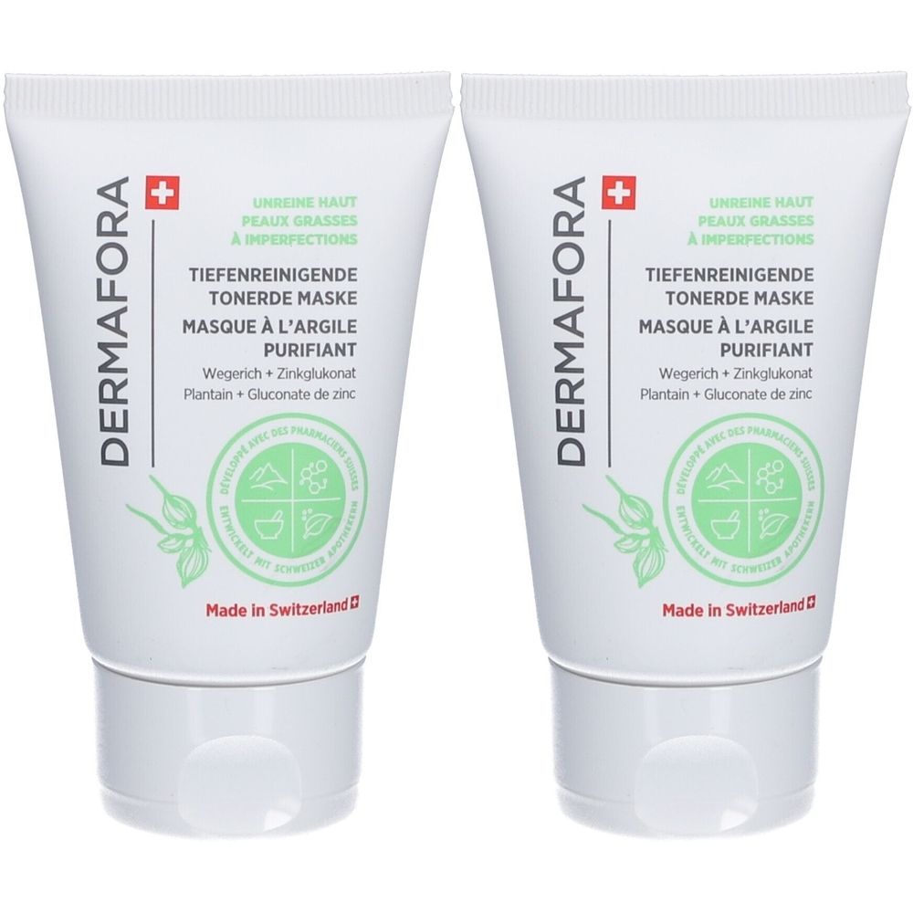 Zwei weiße Tuben mit grüner Schrift und dem Logo von DERMAFORA. Text: Tiefenreinigende Tonerde Maske. Hergestellt in der Schweiz.