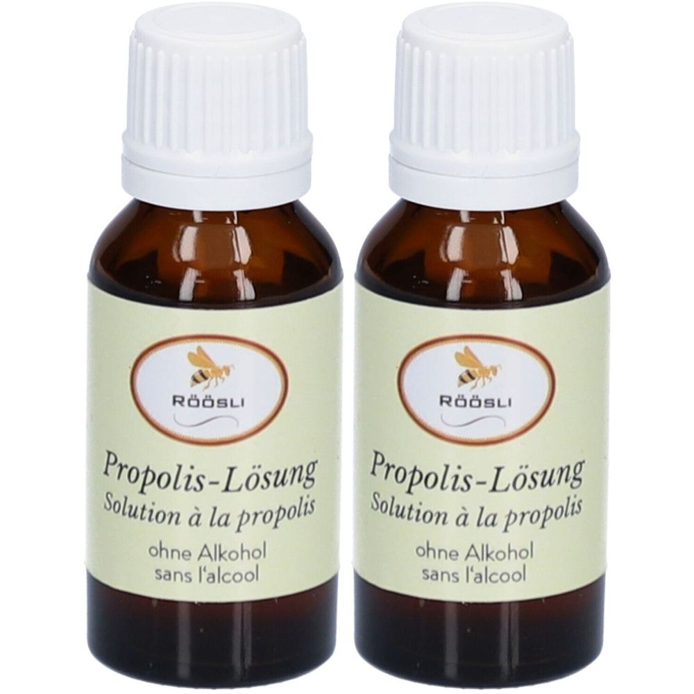 Deux flacons en verre brun avec bouchon blanc. Étiquette avec texte: Propolis-Lösung, sans alcool. Marque: RÖÖSLI.