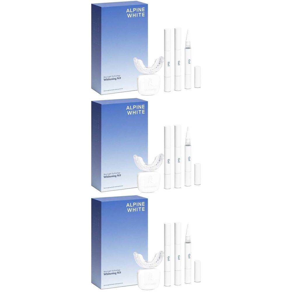 Plusieurs kits de blanchiment des dents. Boîtes bleues avec lettrage blanc ALPINE WHITE. Contient gouttières, stylos et récipients.